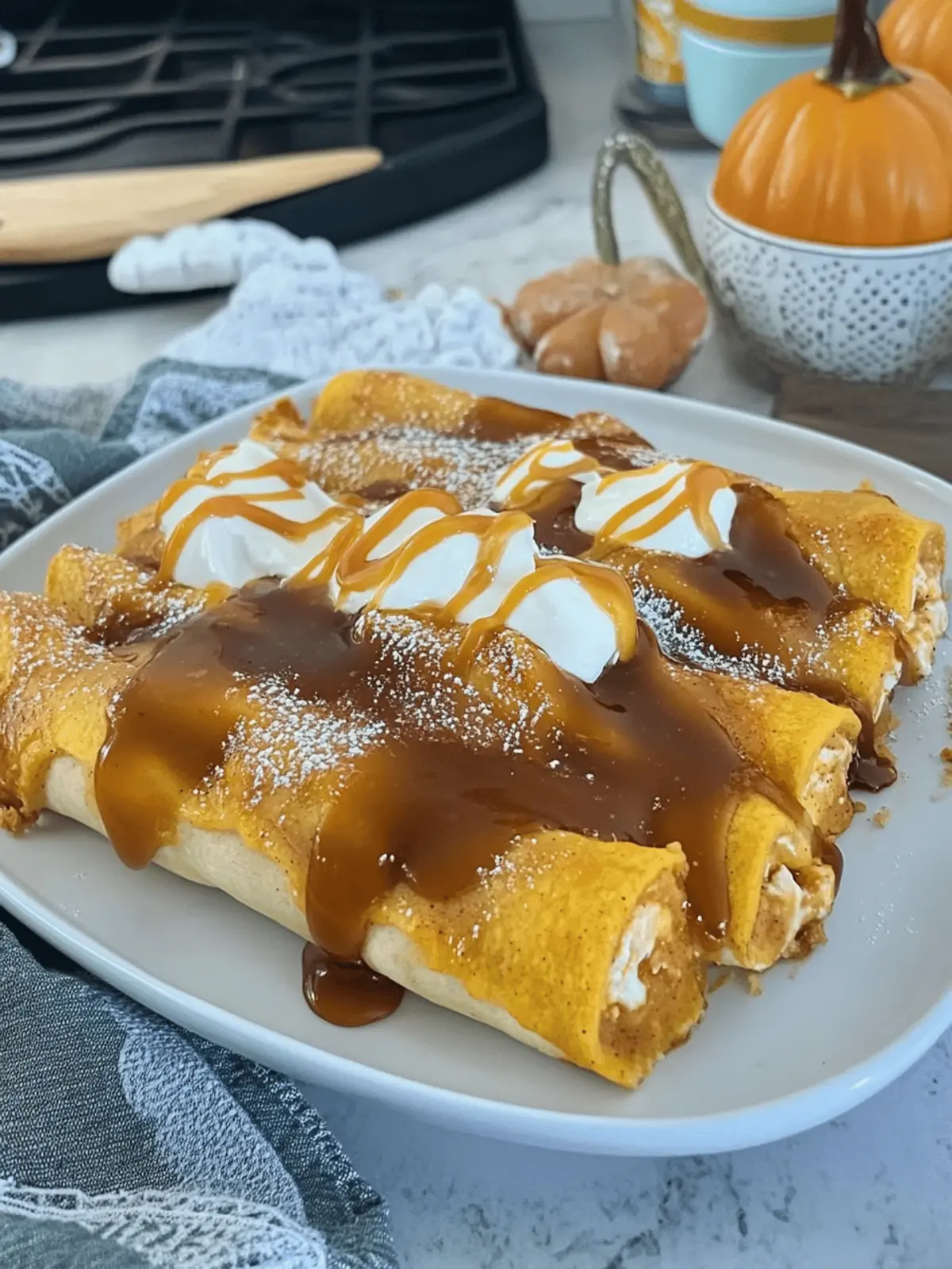 Pumpkin Spice Cheesecake Enchiladas with Caramel Drizzle